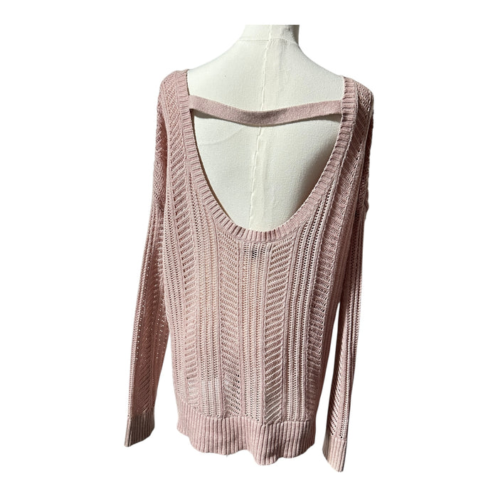 the delicate open-knit stitching and soft pink cotton-blend fabric on an American Eagle sweater.