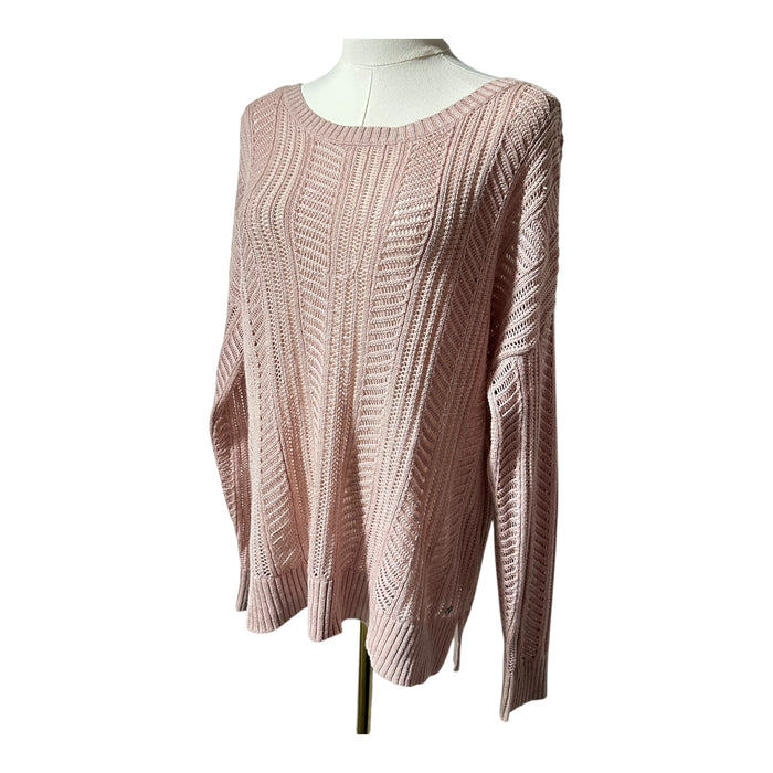 delicate open-knit stitching and soft pink cotton-blend fabric on an American Eagle sweater.