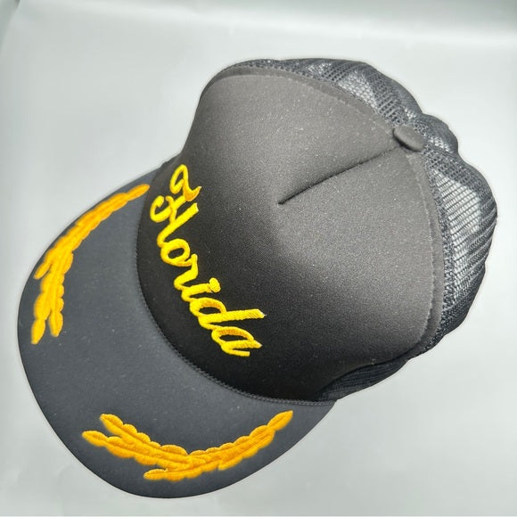 T.I. Vintage Florida Black Trucker Hat – Gold Embroidered Snapback from PanacheProse