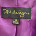 Close-up of DN Designs By Danny & Nicole Women's Shawl Collar Jacket label with fabric details.